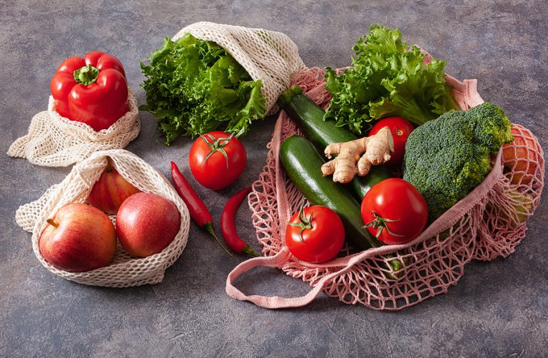 fruits vegetables in reusable mesh cotton bag, plastic