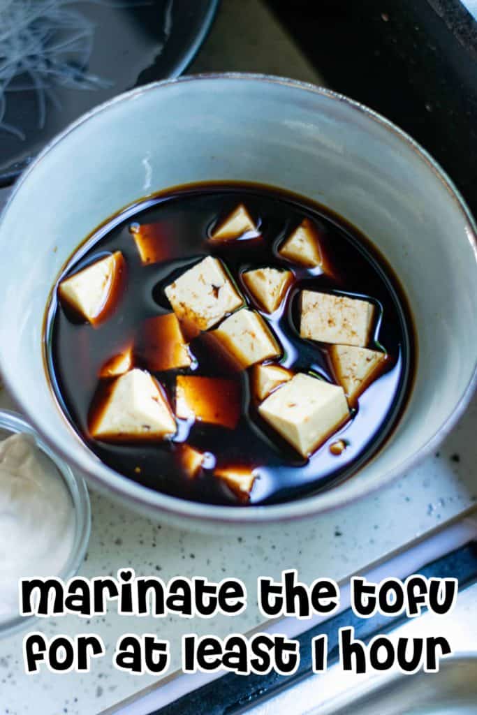 Tofu marinating in a bowl