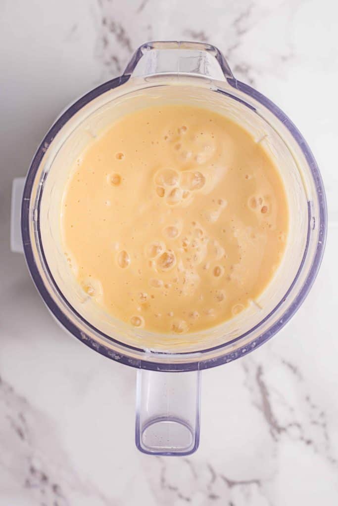 Overhead shot of mango lassi.