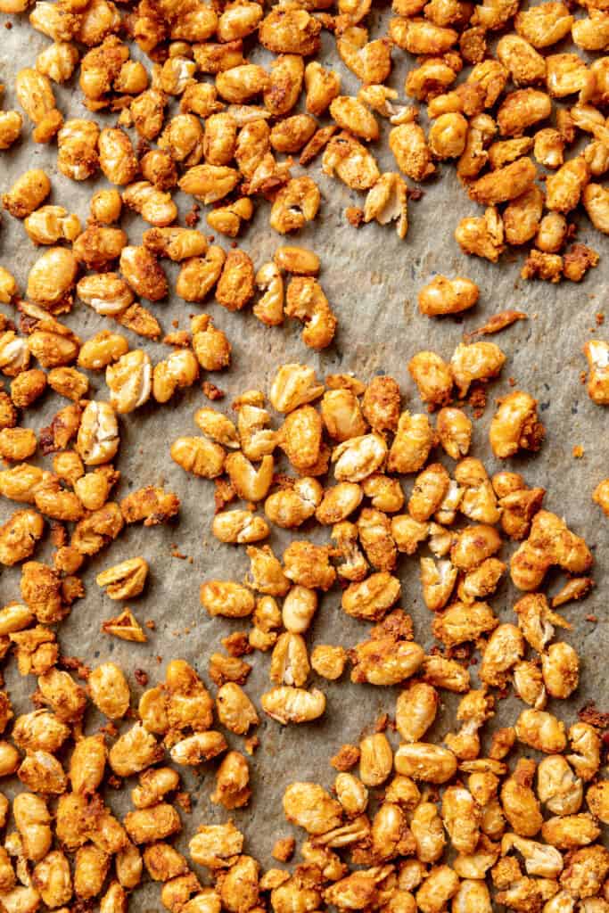 Overhead view of crispy white beans on a sheet pan.