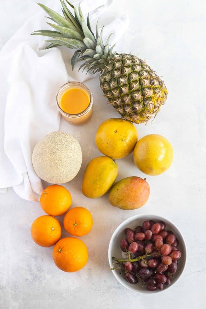 Overhead view of fresh fruit on a white background.