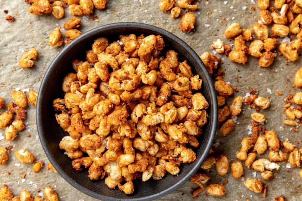 Overhead view of crispy white beans in a gray bowl.