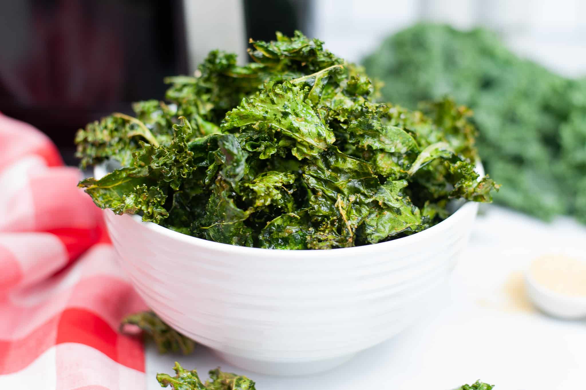 White bowl with air fryer kale chip.