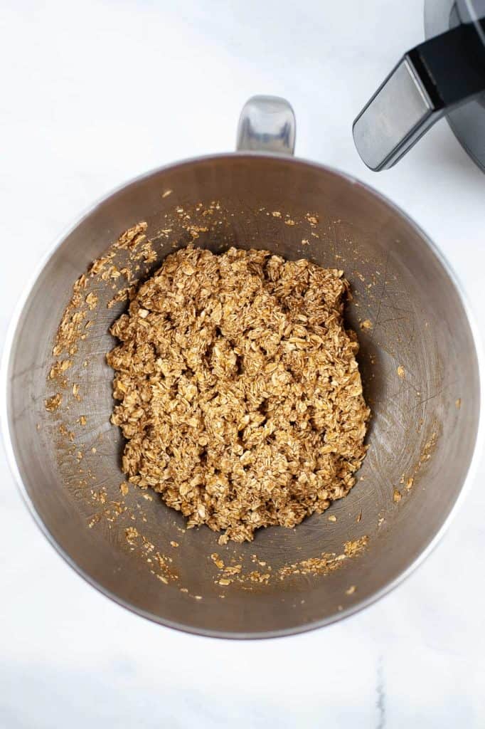 Granola ingredients in a stainless steel bowl.
