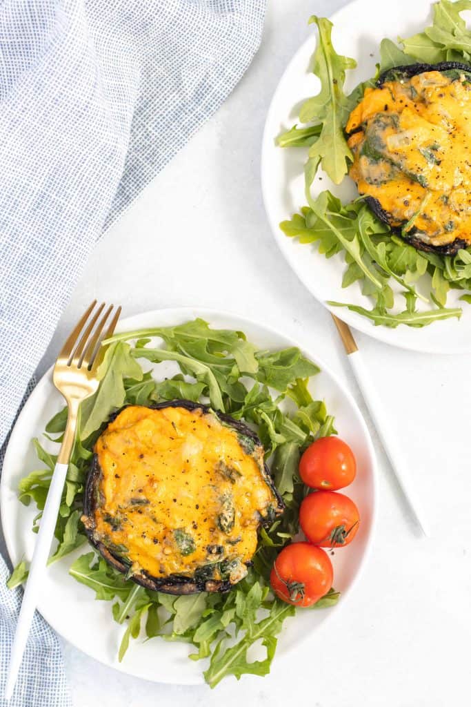 Overhead view of stuffed portobello mushrooms.