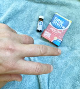Showing invisible Liquid Bandage on knuckle.