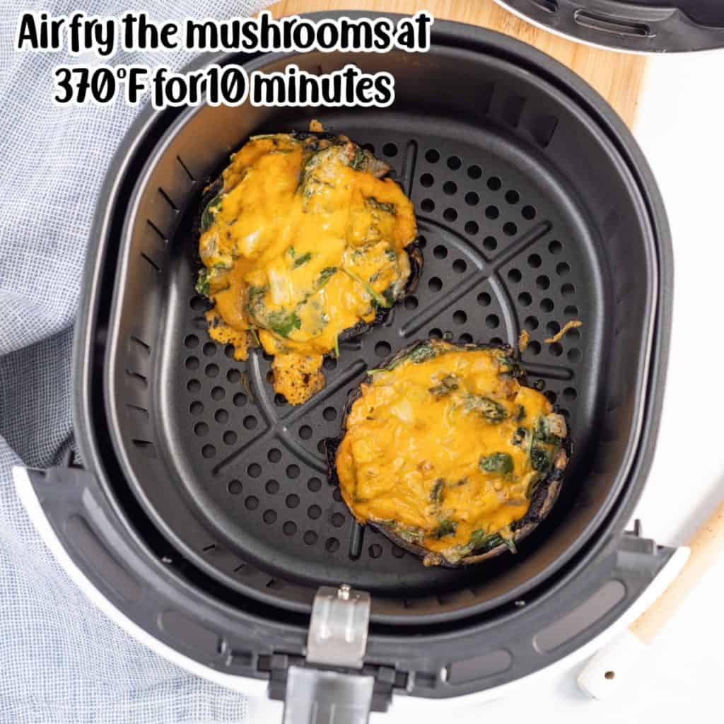 Overhead view of stuffed mushrooms in air fryer.