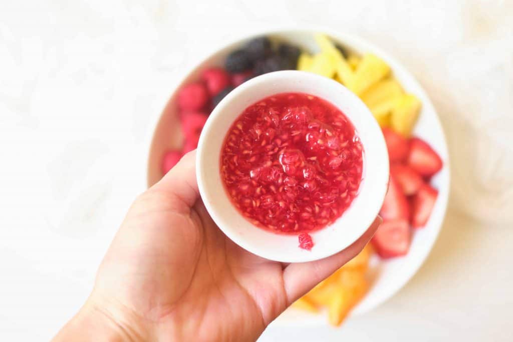 Raspberries pureed in a small bowl.