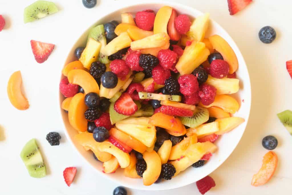 Fruit salad with raspberry sauce.