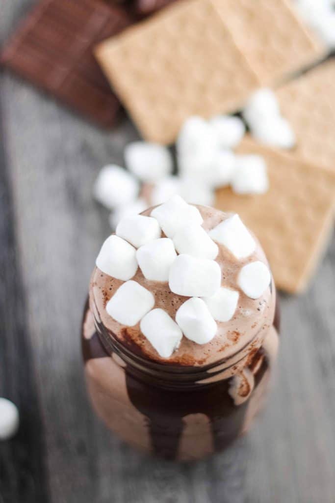 Mini marshmallows on top of a chocolate shake.