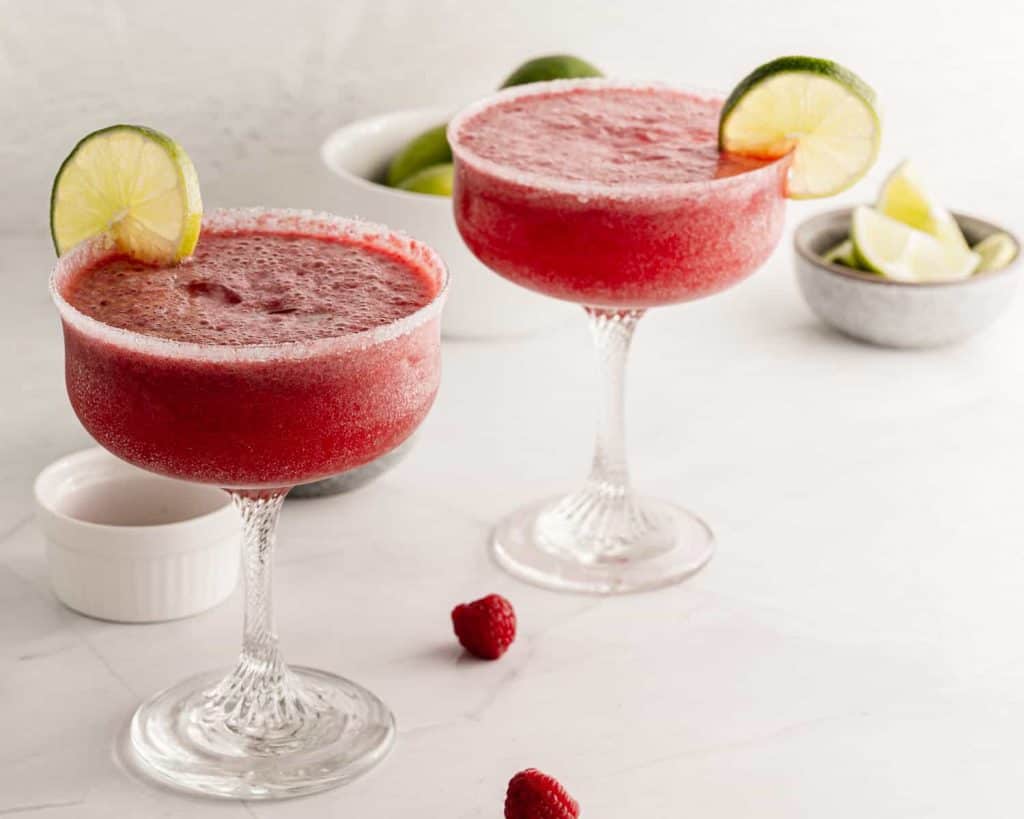 2 raspberry margaritas side by side.