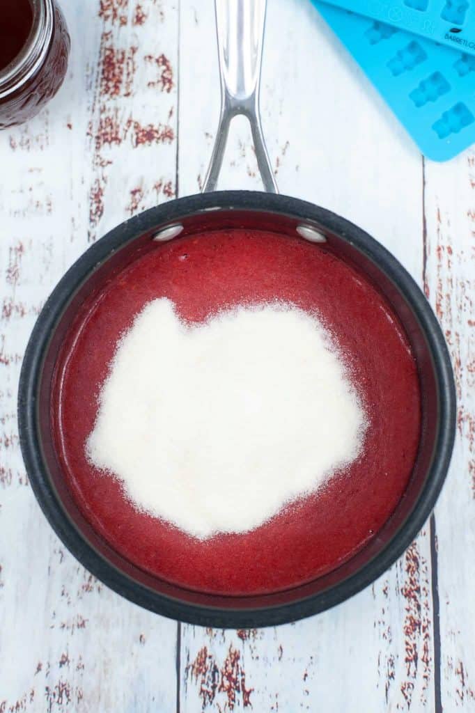 Gelatin added to blended strawberries.