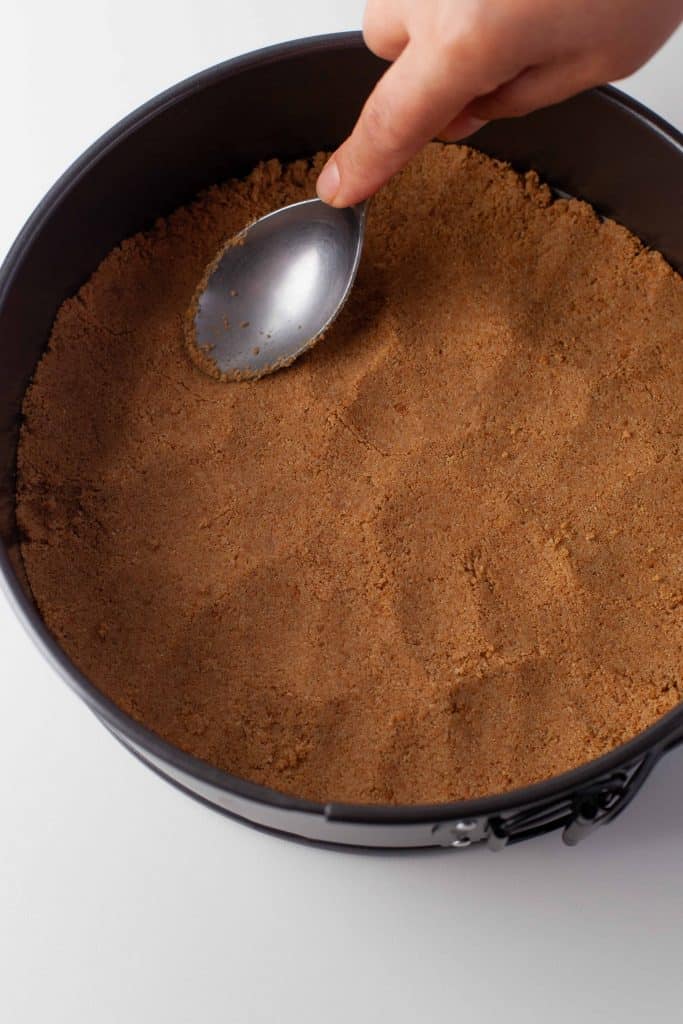 Graham cracker crust in spring form pan.