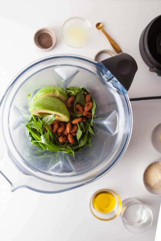 Ingredients in blender for pesto.