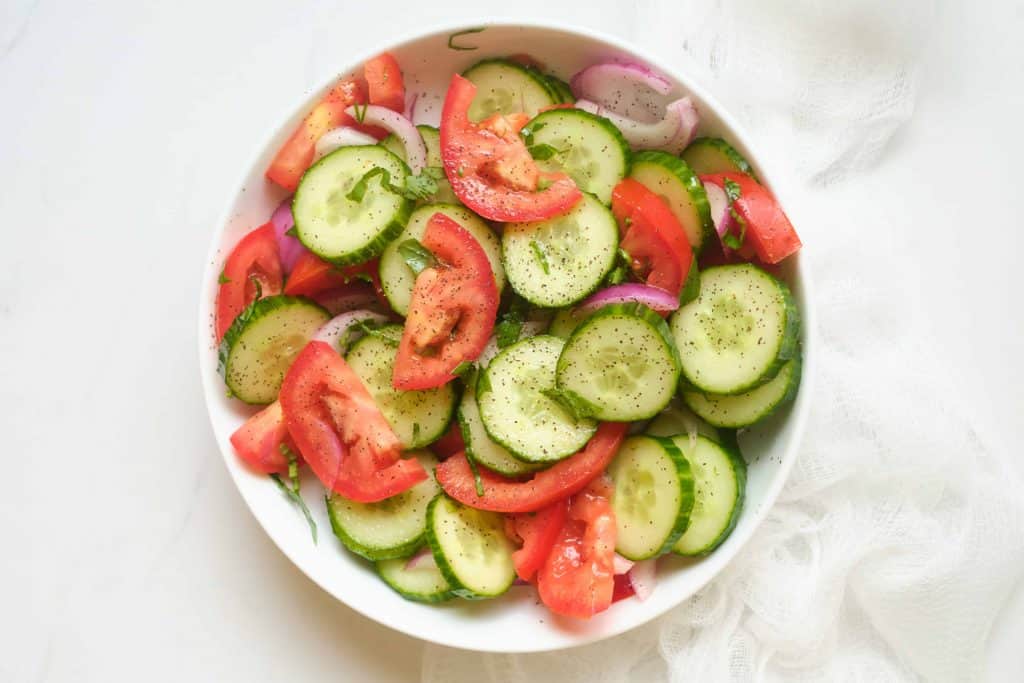 Overhead view of cucumber tomato salad