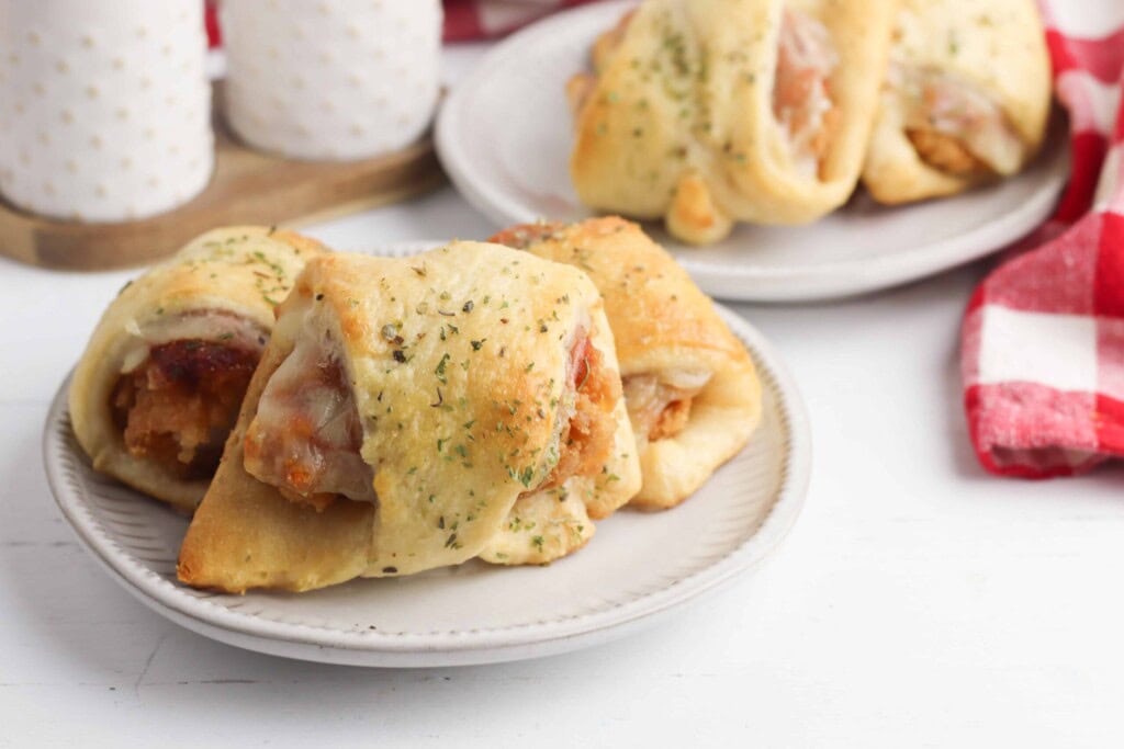 Chicken Parm sliders on a white plate.