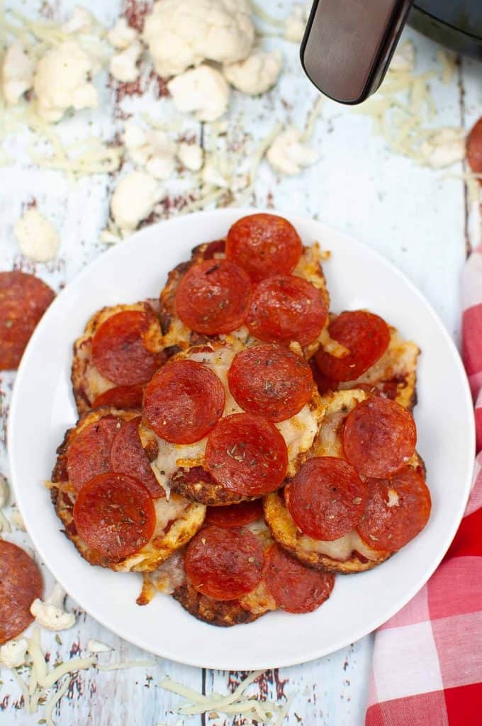Overhead view of Pepperoni Pizza Cauliflower Bites on a white plate.