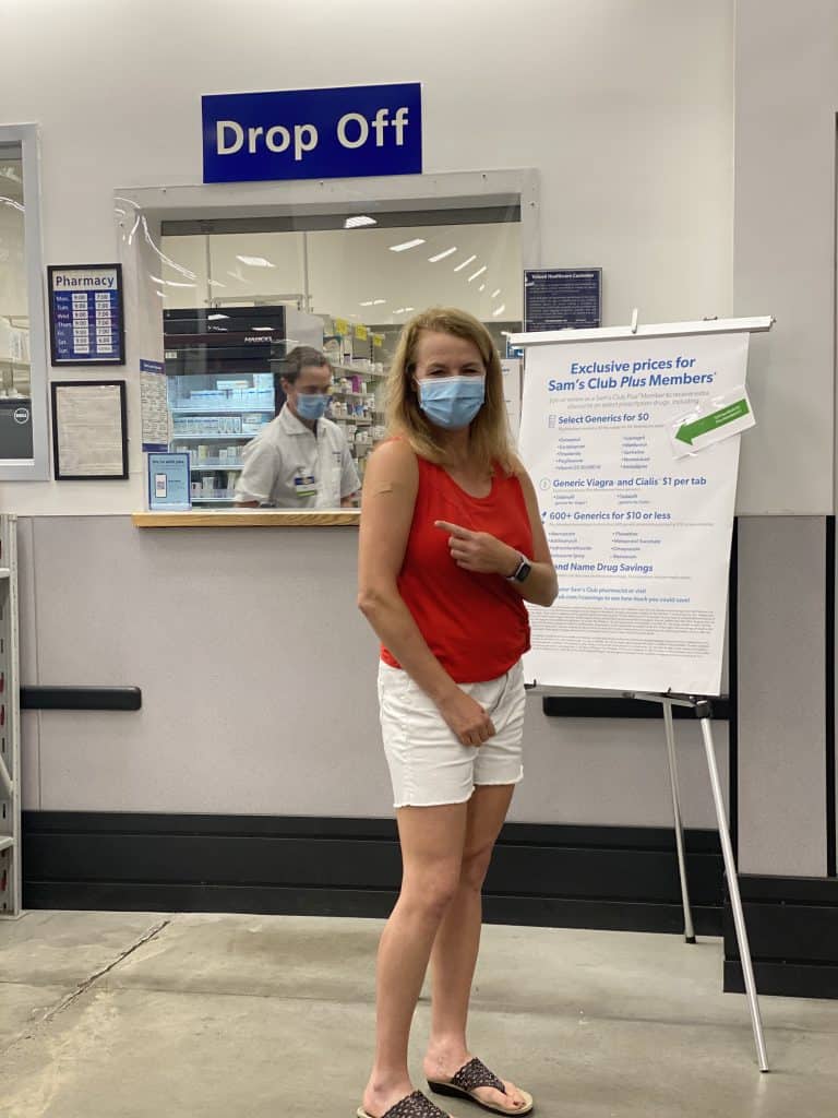 Standing in front of Sam's Club Pharmacy.