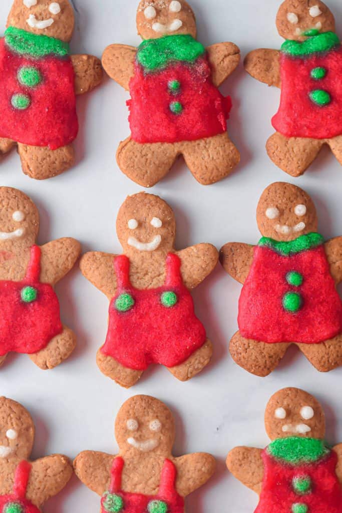Decorated Gingerbread Man Cookies on a sheet pan.