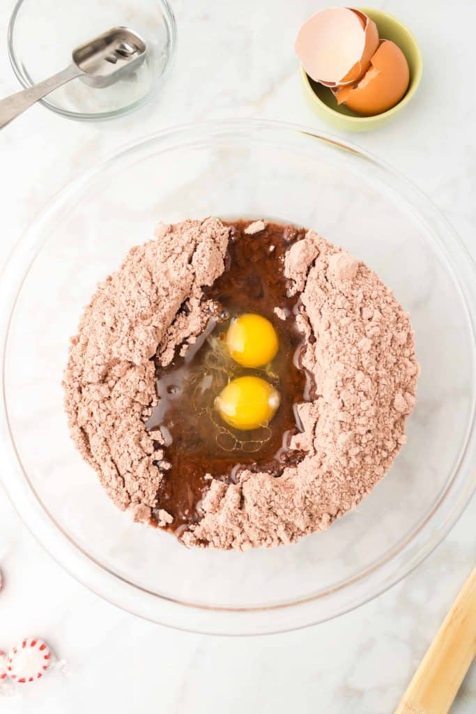 Brownie mix, oil and eggs in a bowl.