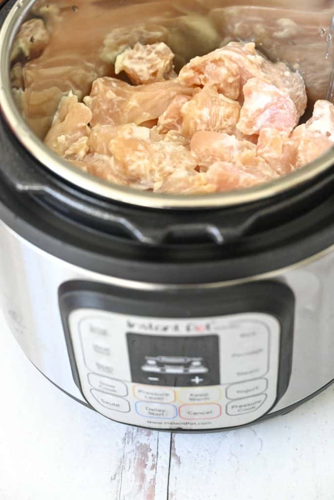 Chicken breast sautéing in an Instant Pot.