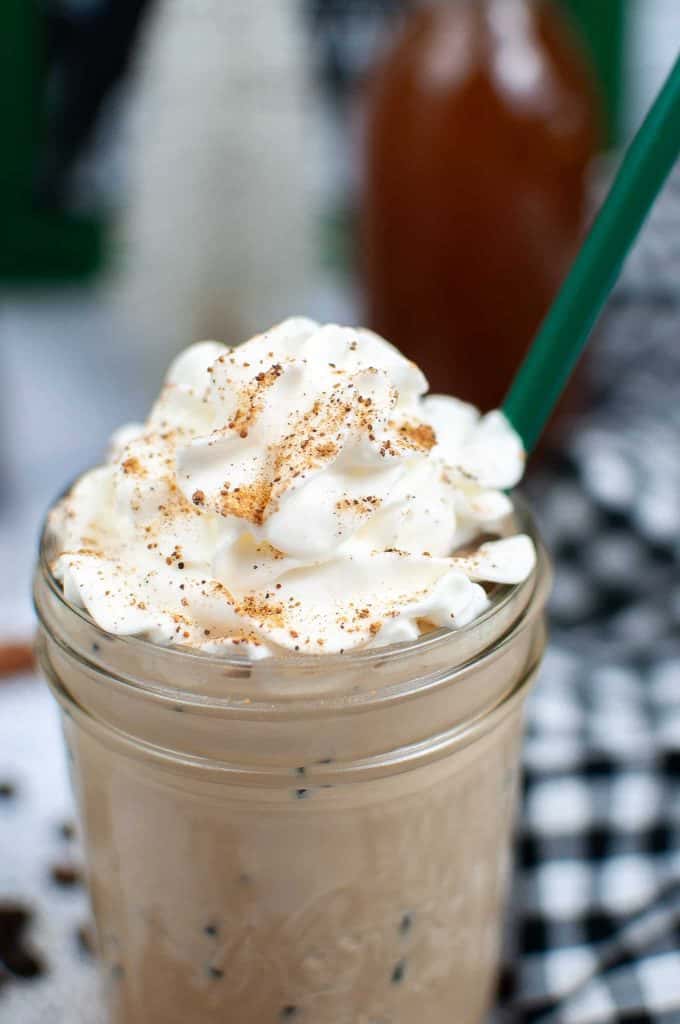 Closeup of coffee drink with whipped cream.