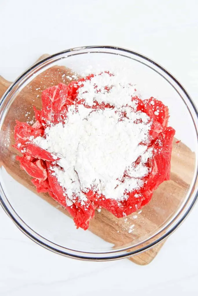 Flour sprinkled on top of Flank Steak.