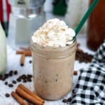 Head on view of coffee drink with whipped cream.