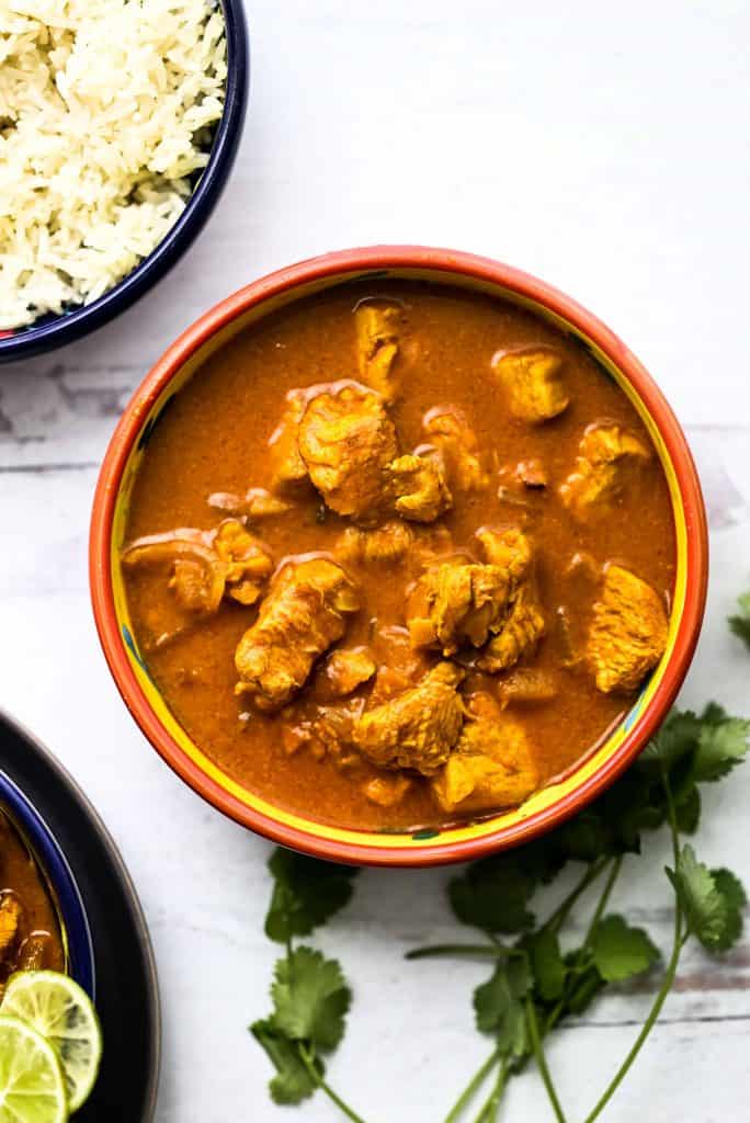 Butter chicken with sauce in a bowl.