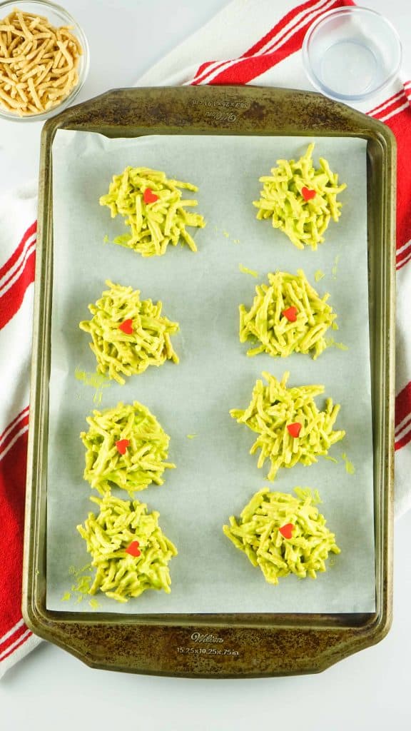 Overhead view of Green Haystack Cookies on parchment lined baking sheet.
