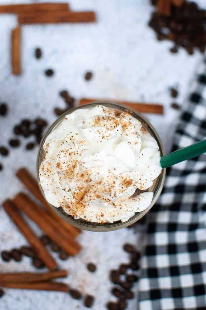 Overhead view of gingerbread latte with whipped cream.