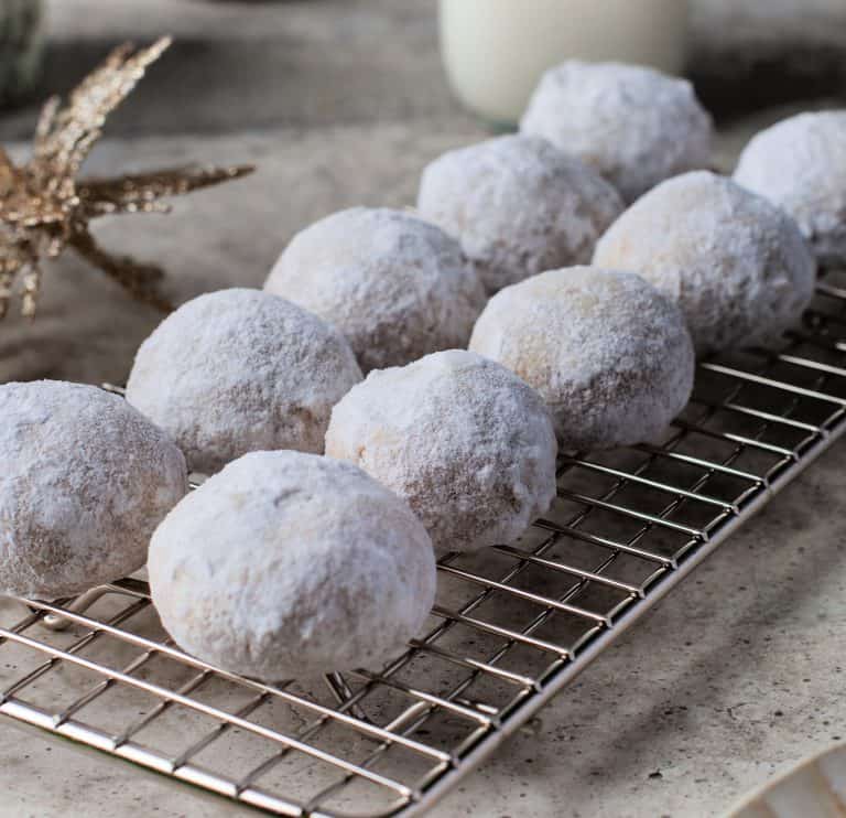 Snowball Cookies on a baking rack.