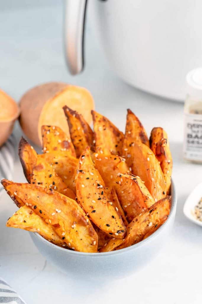 Sweet potato wedges in a white bowl.