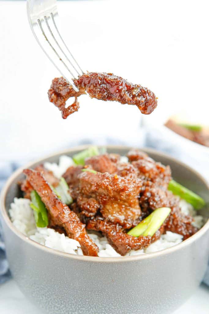 Mongoilan beef on a fork.