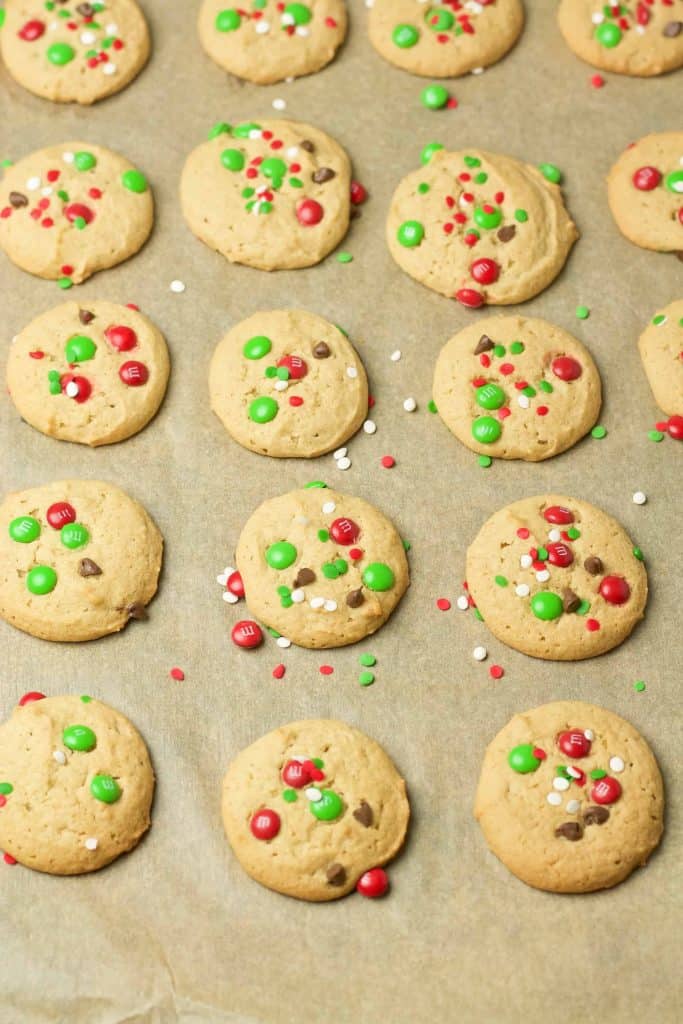 Cookies hot out of the oven on a baking sheet.