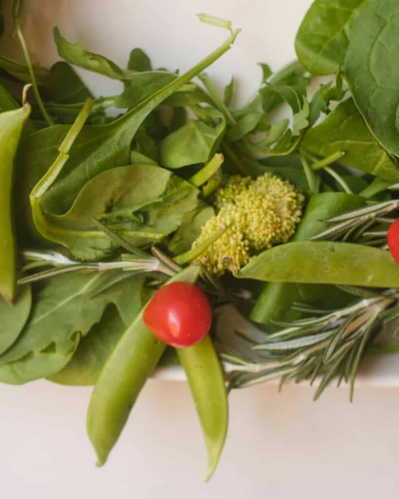Closeup of vegetable wreath bow.