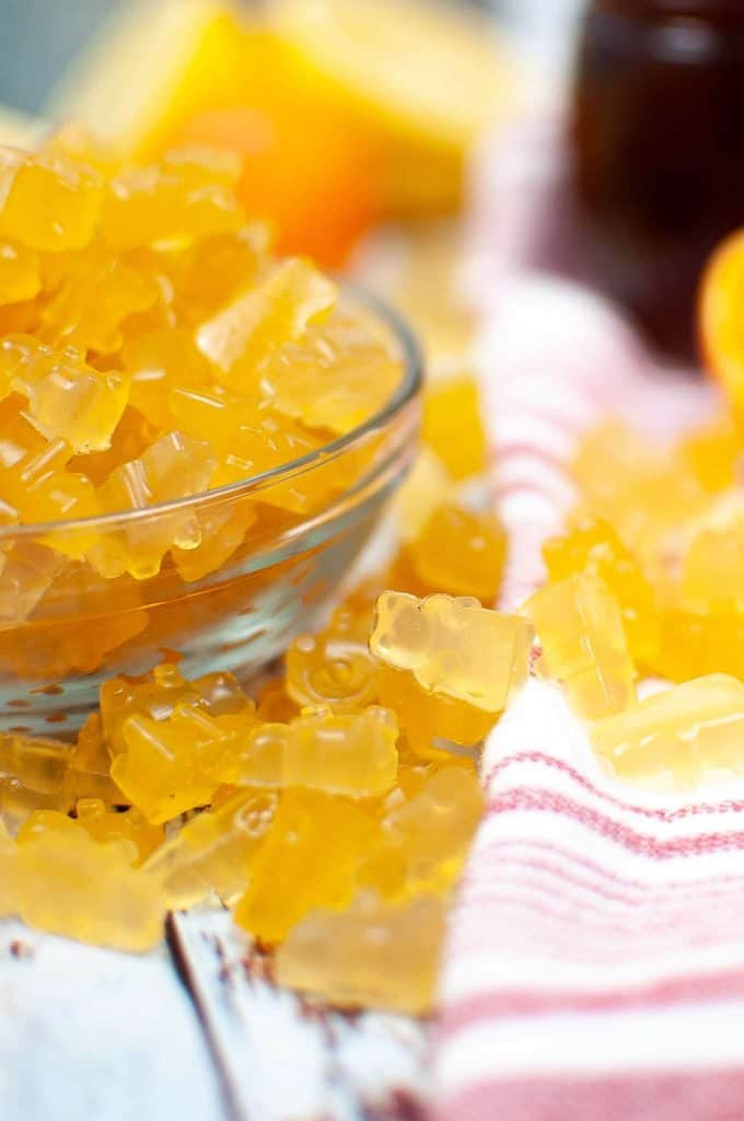 Closeup of orange fruit bears in a bowl.