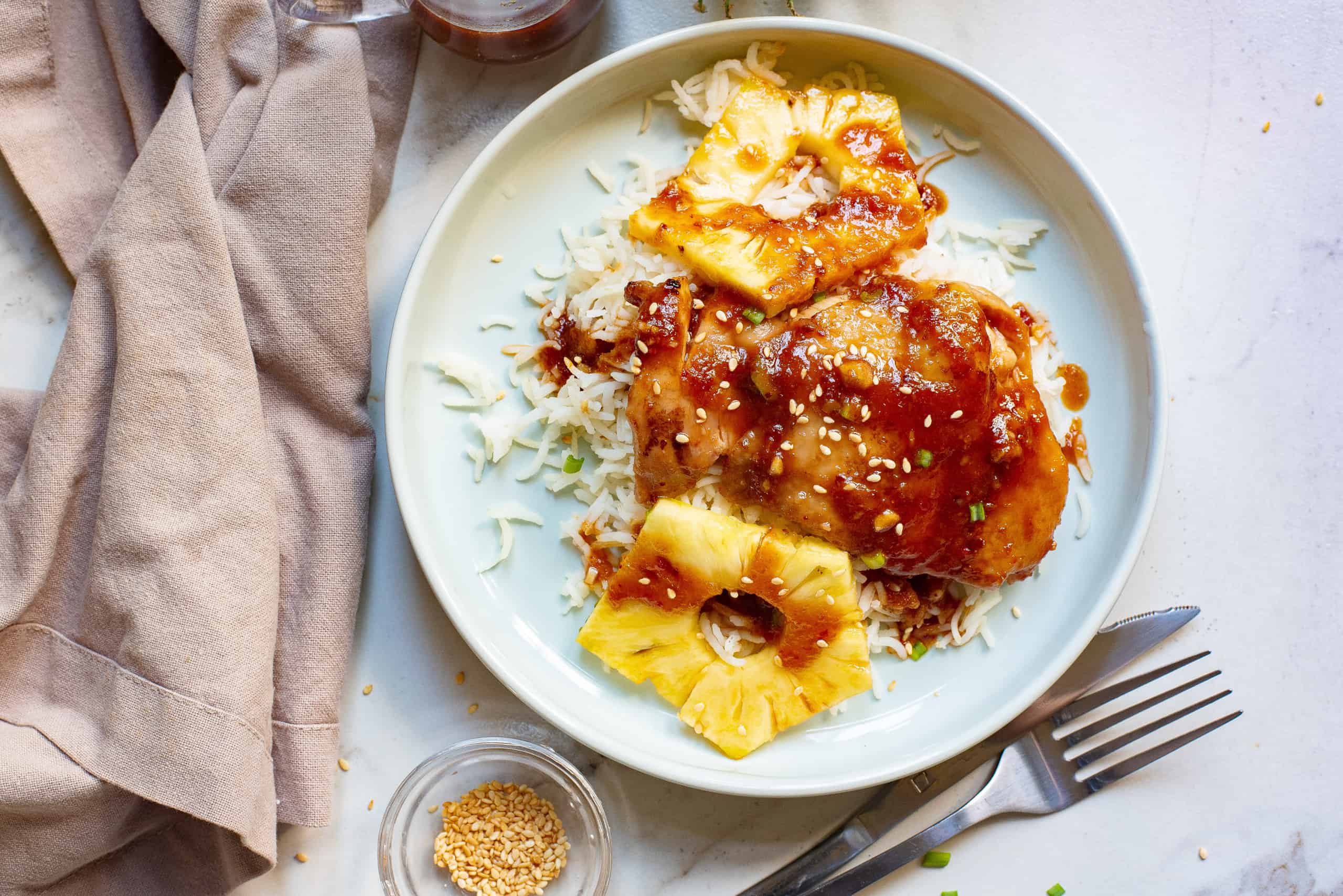 Overhead view of Hawaiian Chicken with rice and pineapple slices.