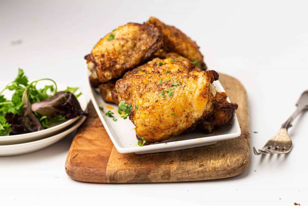 Head on photo of chicken thighs.