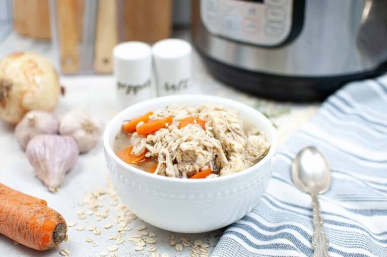 Instant Pot Chicken Barley Soup in a white bowl.