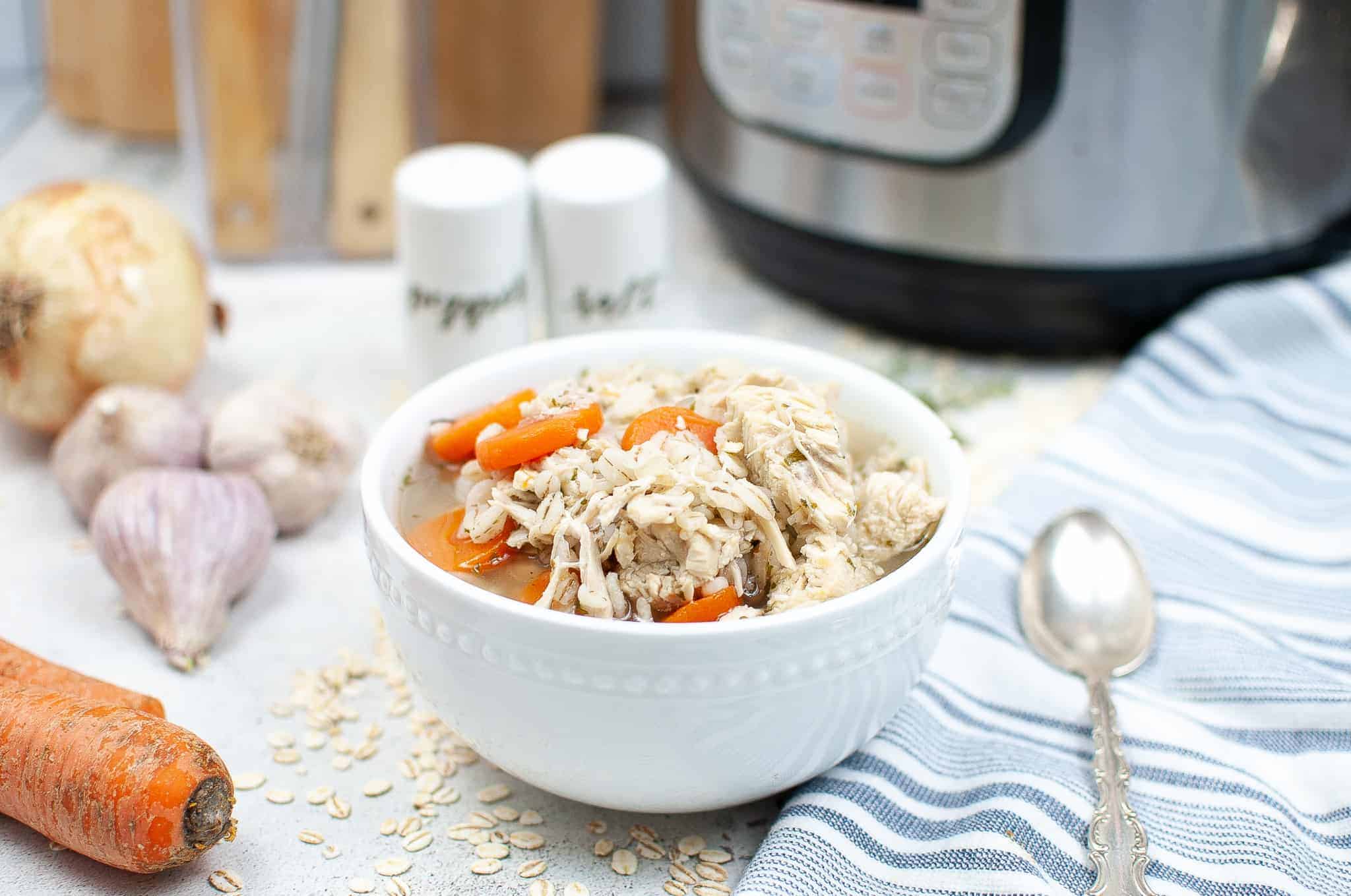 Instant Pot Chicken Barley Soup in a white bowl.