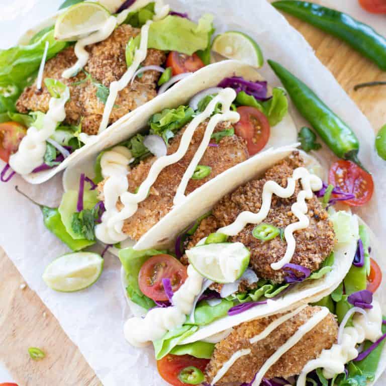 Overhead view of air fryer tacos.