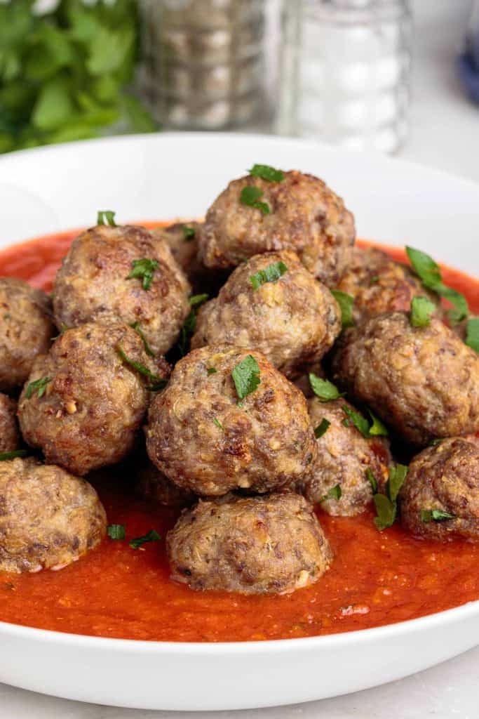 Air Fryer Meatballs in sauce in a white bowl.