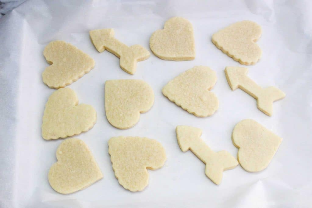 Heart shaped sugar cookies and arrows.