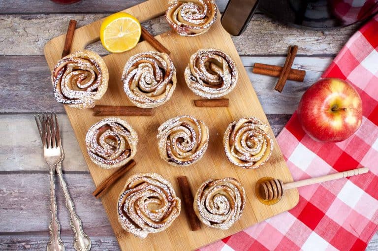 Overhead view of air fryer apple roses.