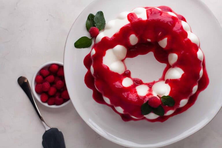 Overhead view of yogurt jello with raspberry sauce.
