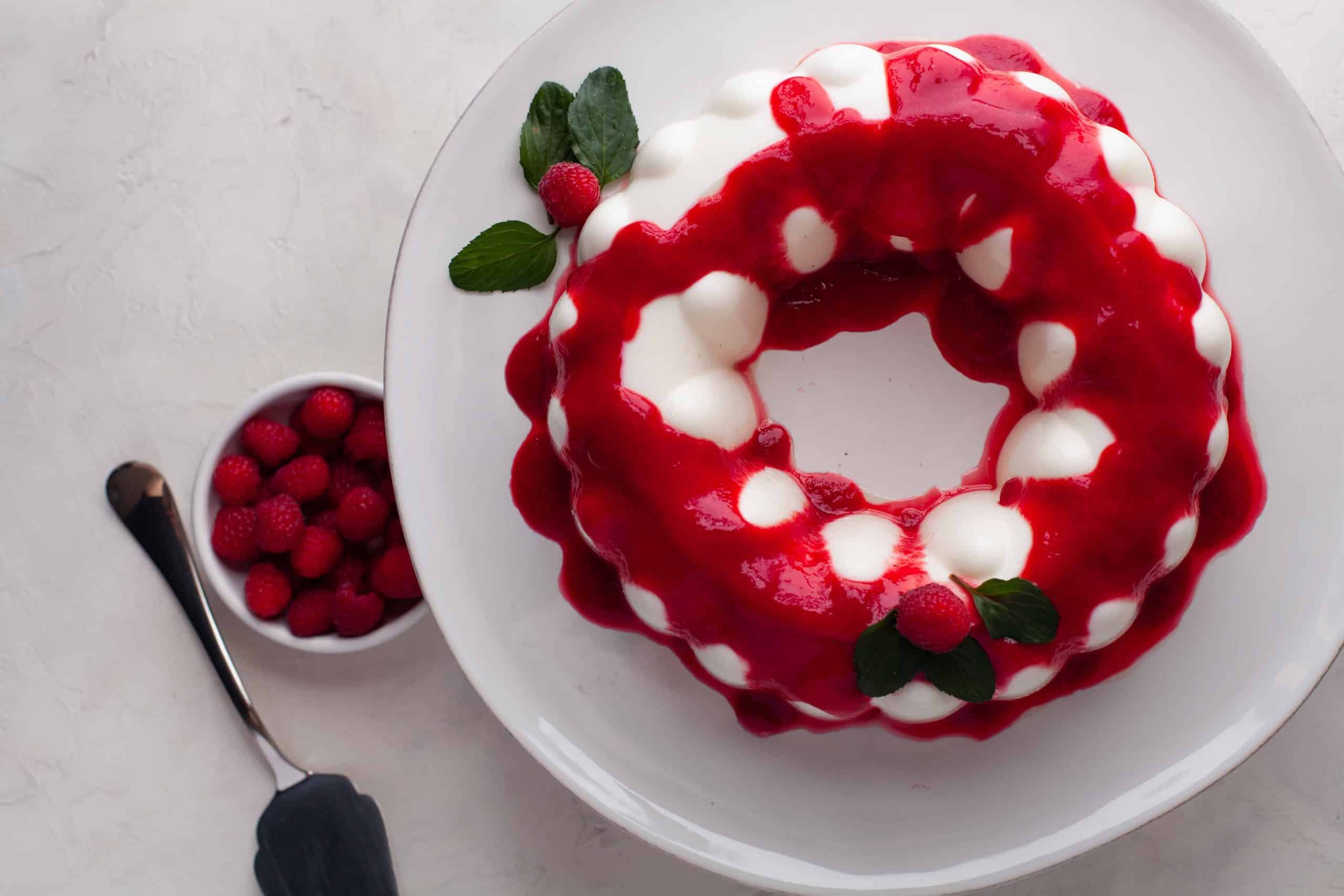 Overhead view of yogurt jello with raspberry sauce.