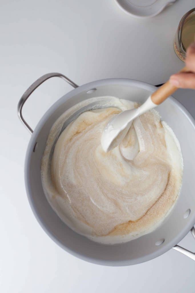 Yogurt and sour cream in a sauce pan.