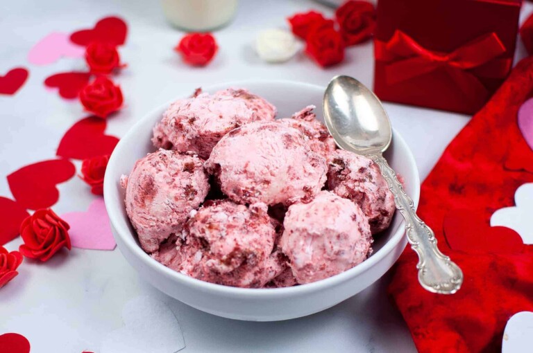 Red velvet ice cream in a white bowl.