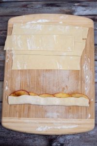 Puff pastry folded over apple slices.